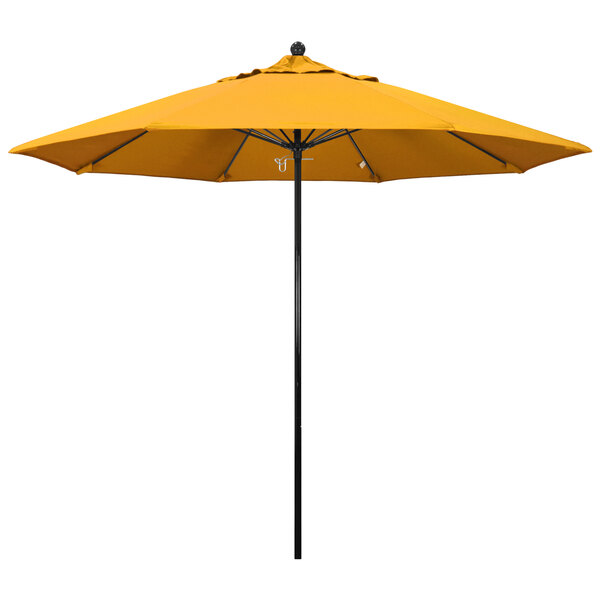 A California Umbrella with a yellow Pacifica canopy and a black pole.