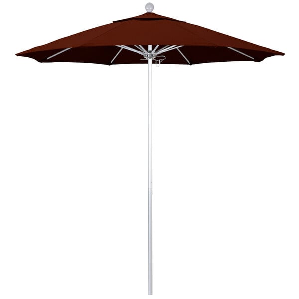 A close-up of a red California Umbrella with a brick red canopy.