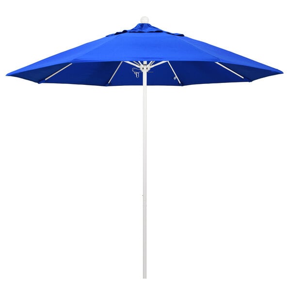 A California Umbrella round outdoor table umbrella with a Pacific Blue Sunbrella canopy and a white pole.