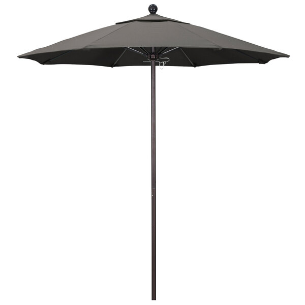 A California Umbrella with a bronze pole and taupe canopy.