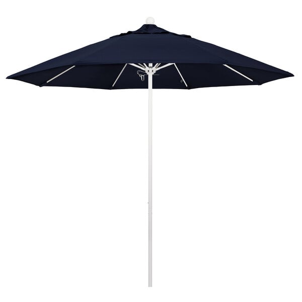 A close-up of a California Umbrella with a navy blue Sunbrella canopy.