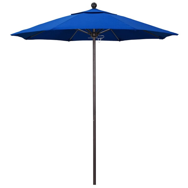 A blue California Umbrella on a bronze pole on a white background.