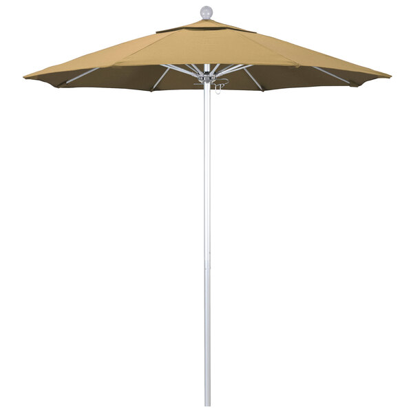 A champagne California Umbrella with a silver pole.