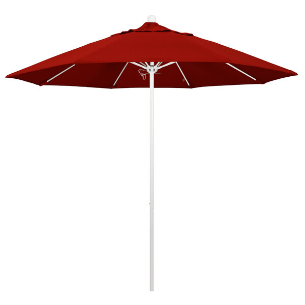 A close-up of a red California Umbrella with Sunbrella Jockey Red fabric on a white pole.
