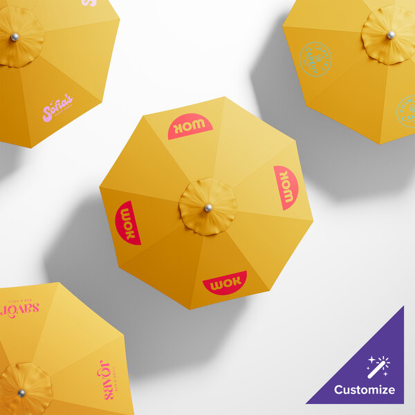 A group of yellow California Umbrella ALTO table umbrellas with different designs on them.