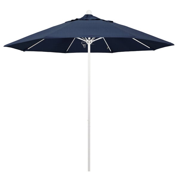 A California Umbrella ALTO round outdoor umbrella with a blue Sunbrella canopy and a white pole.