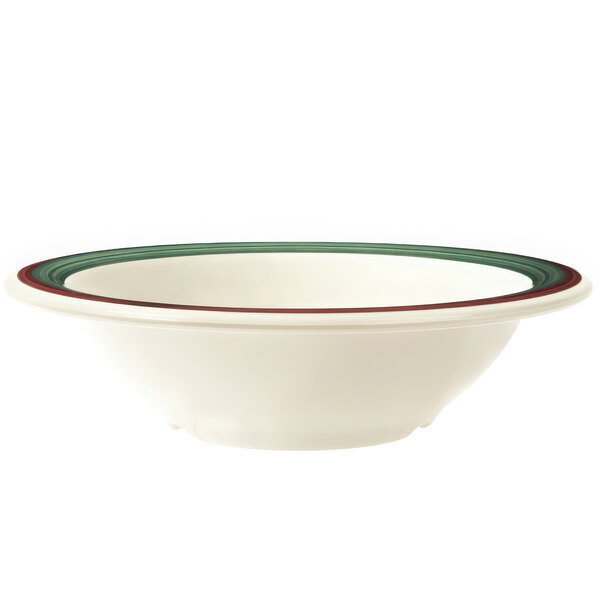 A close-up of a white Diamond Portofino bowl with a red and green rim.