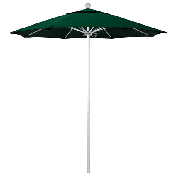 A Hunter green California Umbrella on a white pole.