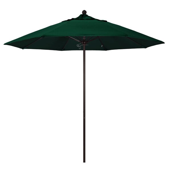 A green California Umbrella on a black pole.