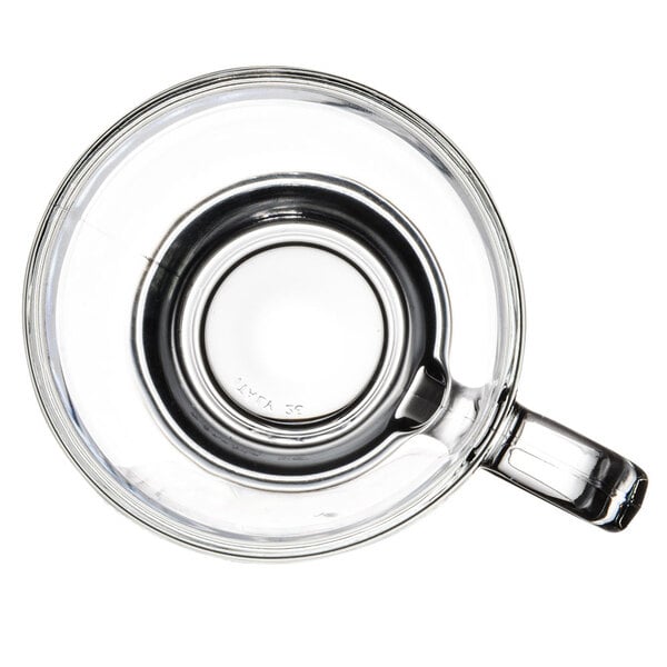 A Libbey clear glass cappuccino cup with a handle.