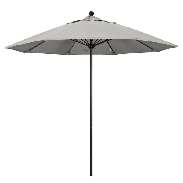 A California Umbrella ALTO 9' round outdoor umbrella with a bronze pole and granite Sunbrella canopy.