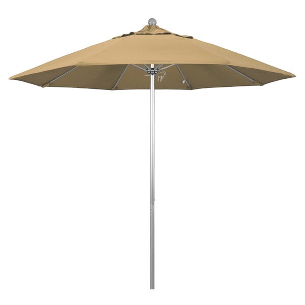 A tan California Umbrella on a silver metal pole.