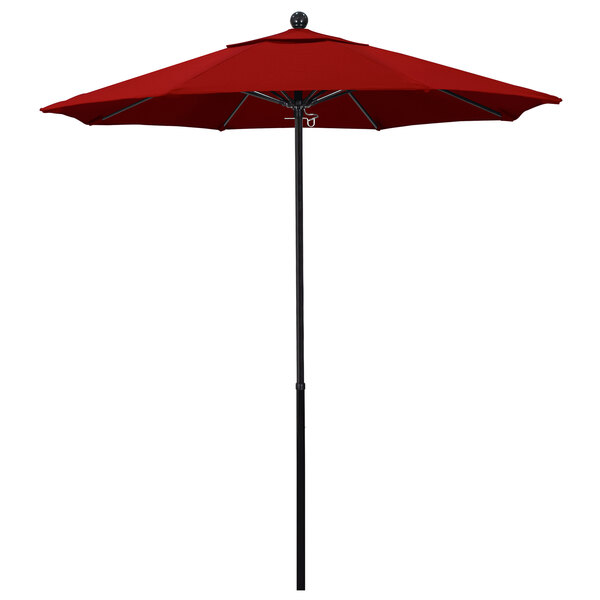 a red umbrella on a pole