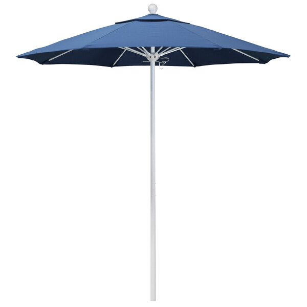 A blue California Umbrella with a white pole.