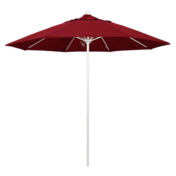 A red California Umbrella on a white pole.