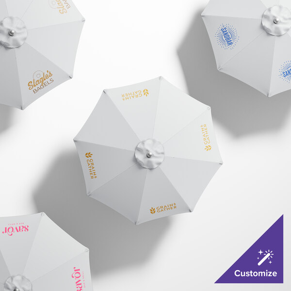 A white California Umbrella with gold text reading "Sunbrella Natural"