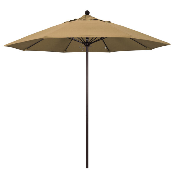 A straw-colored California Umbrella with a bronze pole.