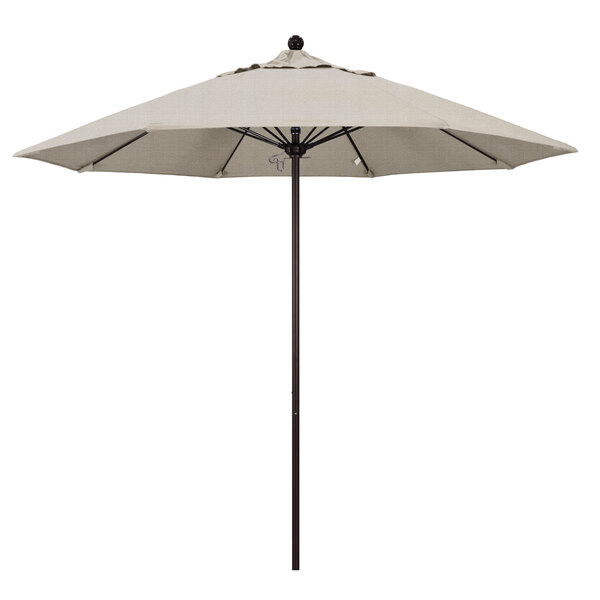A white California Umbrella with a bronze pole.