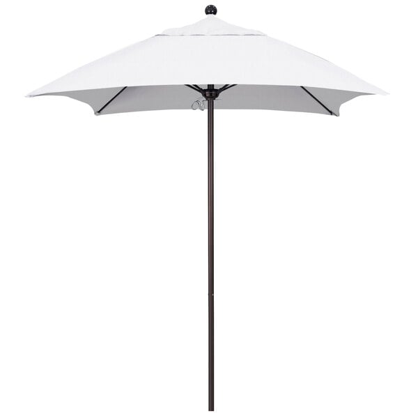 A white umbrella with a bronze pole.