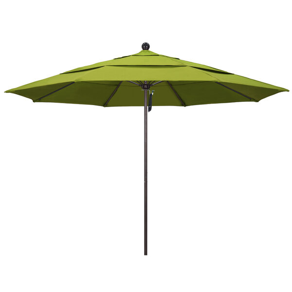 A green California Umbrella on a bronze pole with a black ball on top.