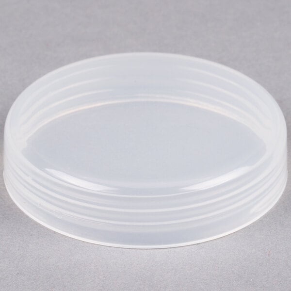 A clear plastic lid on a clear plastic container.
