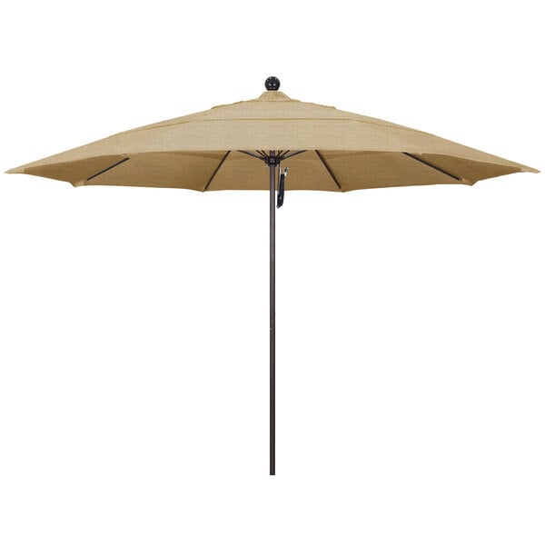 A tan California Umbrella on a bronze pole.