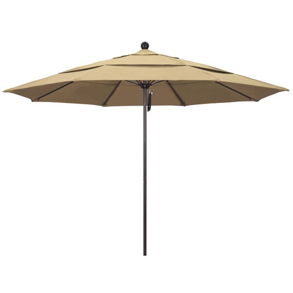 A beige California Umbrella with a bronze pole.