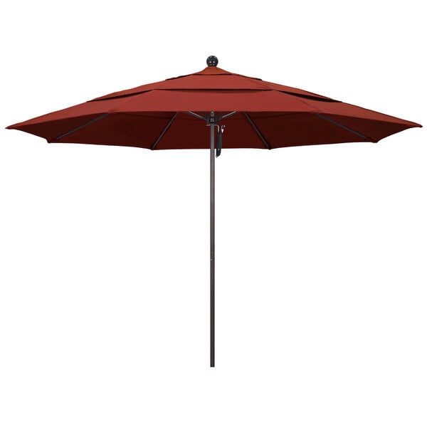 A red California Umbrella on a bronze pole.