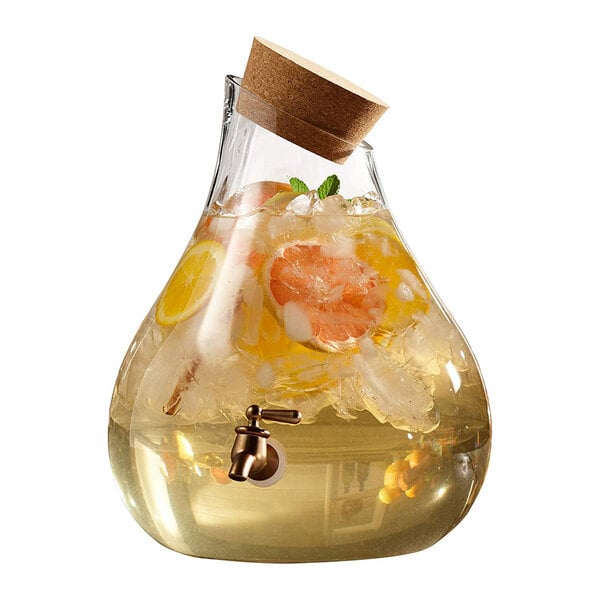 An American Atelier glass beverage dispenser with liquid and a cork.