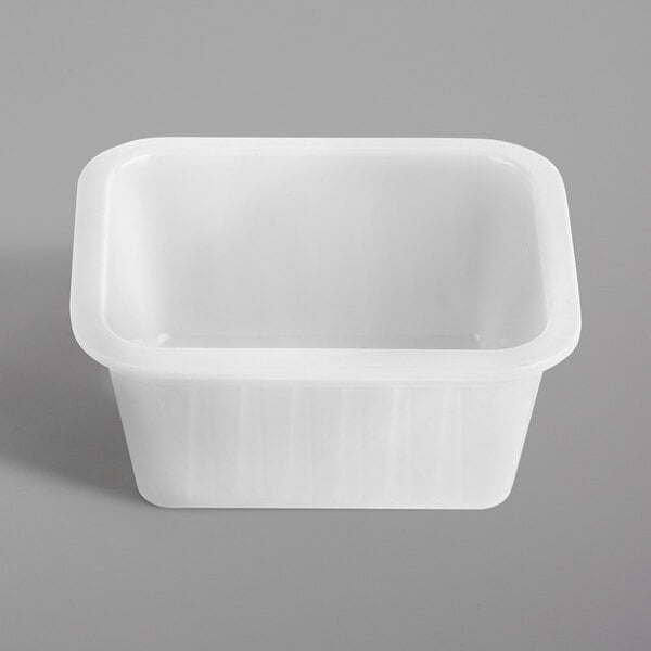 A white rectangular Tablecraft melamine sauce cup with a lid.