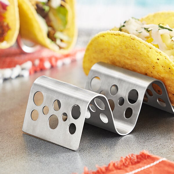 A Tablecraft stainless steel taco holder with circles for 2 or 3 tacos.