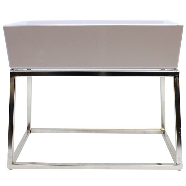 A white rectangular object with stainless steel legs.