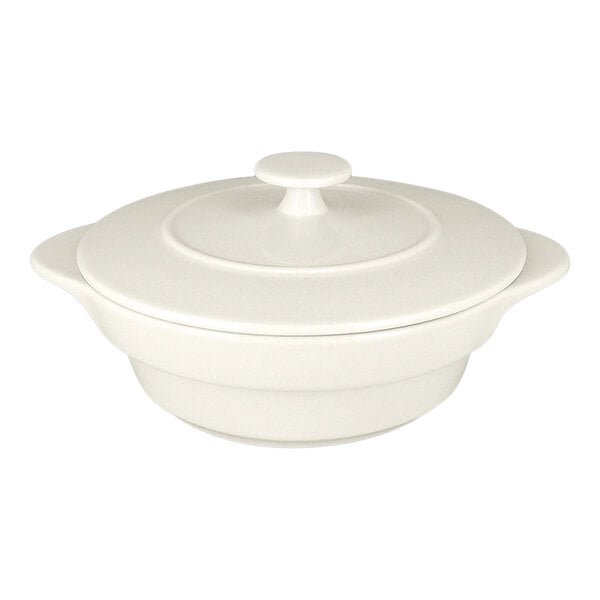 A round sand white porcelain cocotte with a lid.