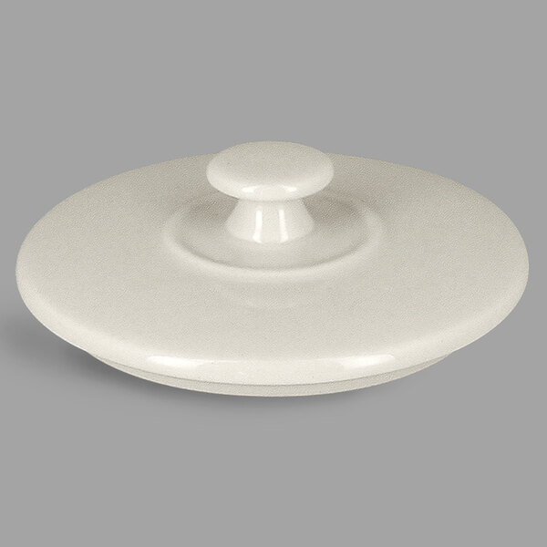 A white round porcelain tureen lid with a round handle.