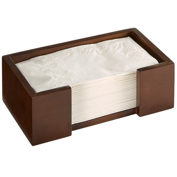 A dark bamboo rectangular napkin holder with a stack of napkins inside.