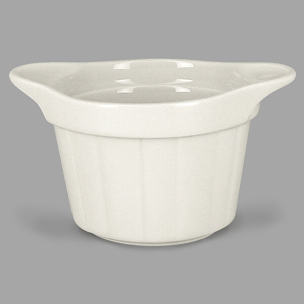 A close-up of a white RAK Porcelain ramekin with grooves.