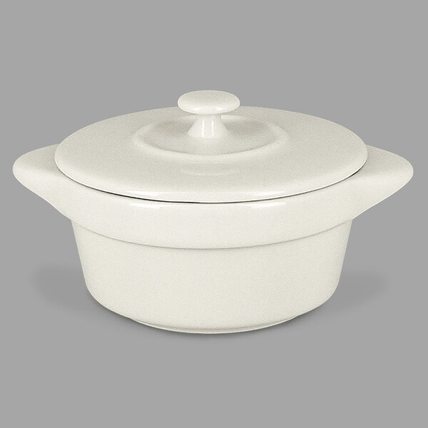 A white ceramic pot with a lid.