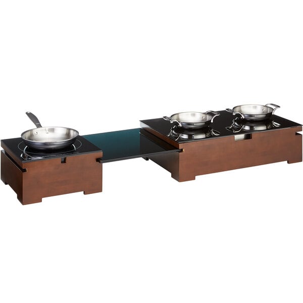A Rosseto Multi-Chef countertop induction heater with two pans on a table.