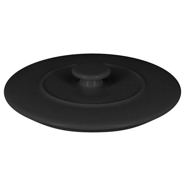 A black lid with a round handle.