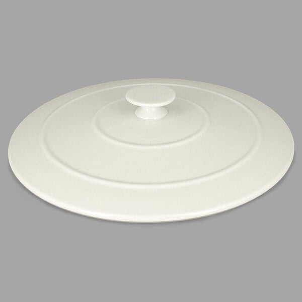 A RAK Porcelain Chef's Fusion sand white porcelain lid with a circular handle.