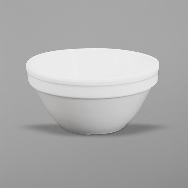 A white bowl with a handle.