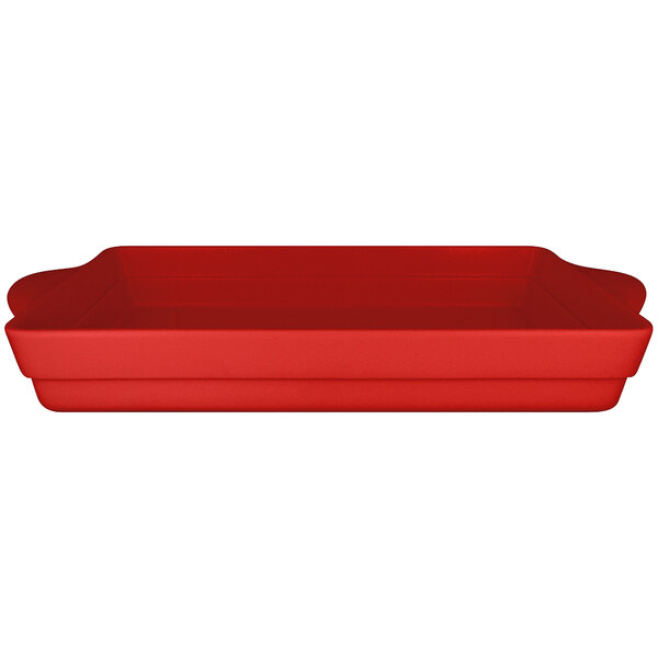 A red rectangular porcelain tureen with handles.