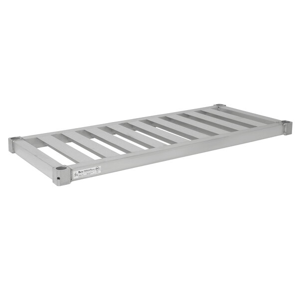 An Eagle Group heavy-duty metal shelf with slats for aluminum beer keg racks.