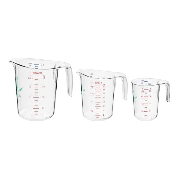 A group of three clear plastic measuring cups with red and blue writing.