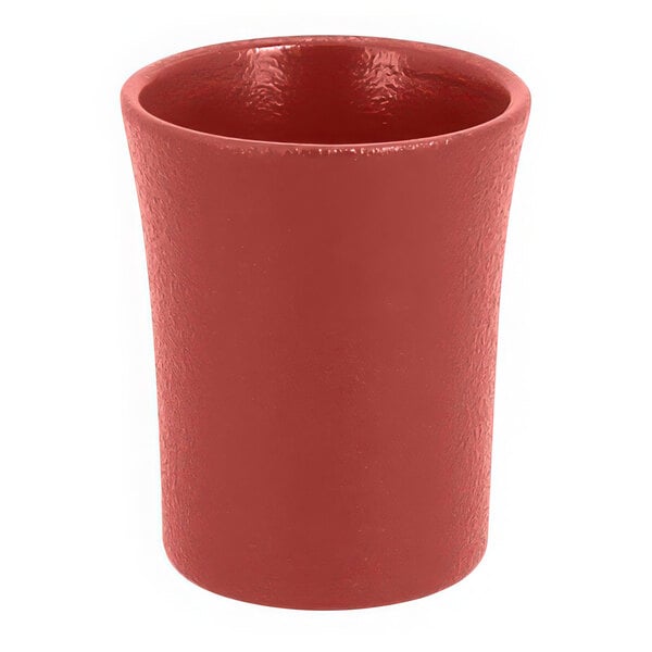 A close up of a RAK Porcelain Magma Dark Red Porcelain cup.