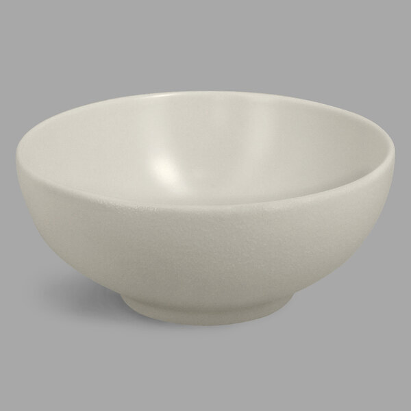 A white RAK Porcelain bowl on a gray background.