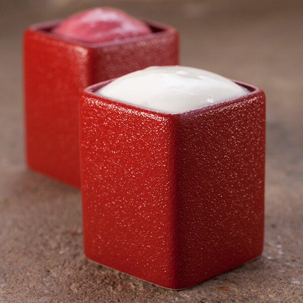 Two RAK Porcelain Neo Fusion ember red ramekins with white food inside.