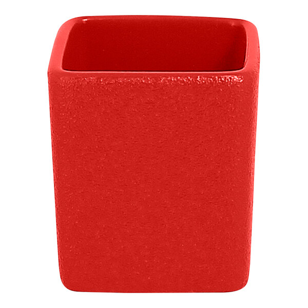 A stack of ember red RAK Porcelain ramekins.