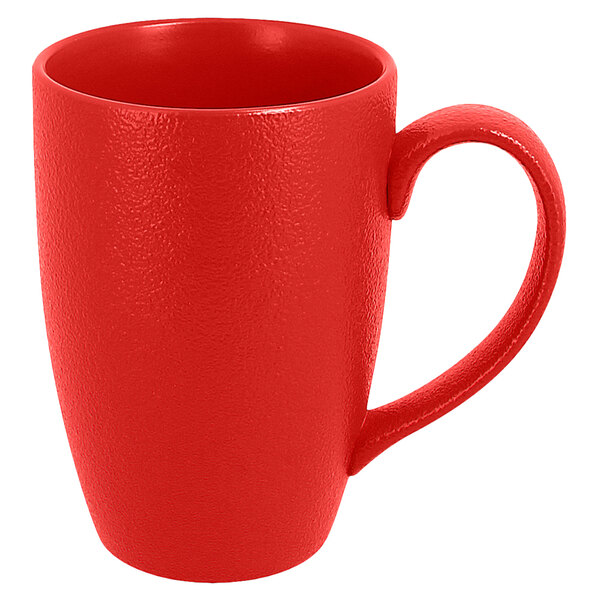 A RAK Porcelain ember red mug with a handle.