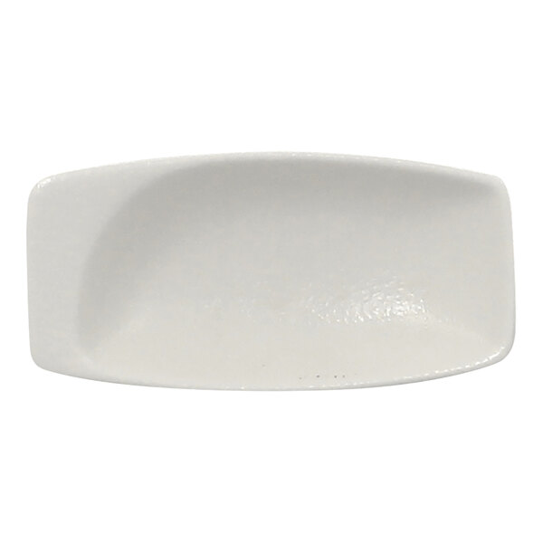 A white rectangular porcelain mini dish with a curved edge.